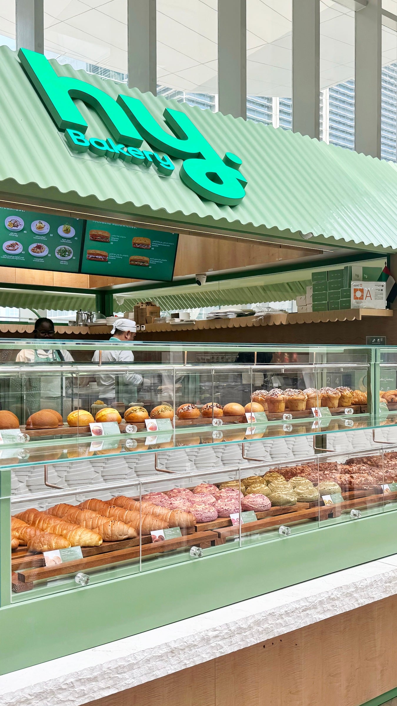 hy Bakery counter with croissants, buns and breads on display
