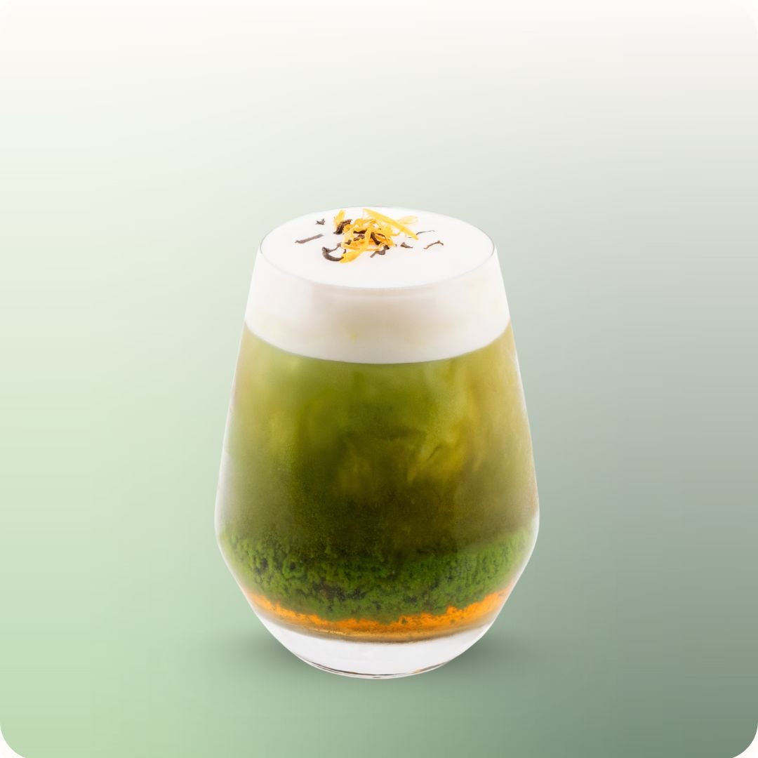 A layered iced matcha drink at hy Bakery