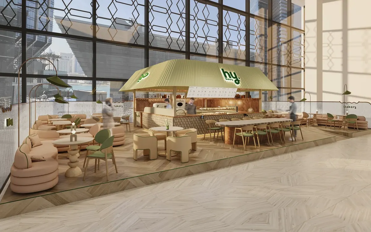 The green bakery counter and seating inside hy Bakery