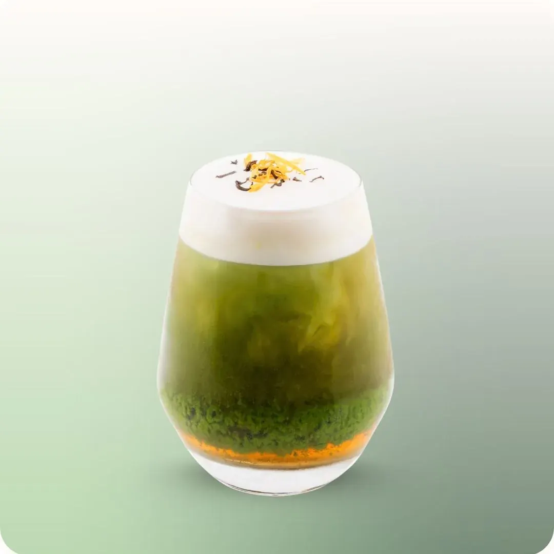 A layered iced matcha drink at hy Bakery